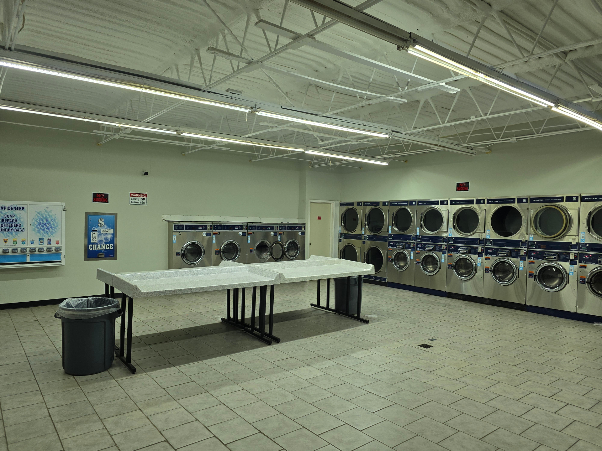 AMZ Laundry interior with rows of Dexter washers and dryers