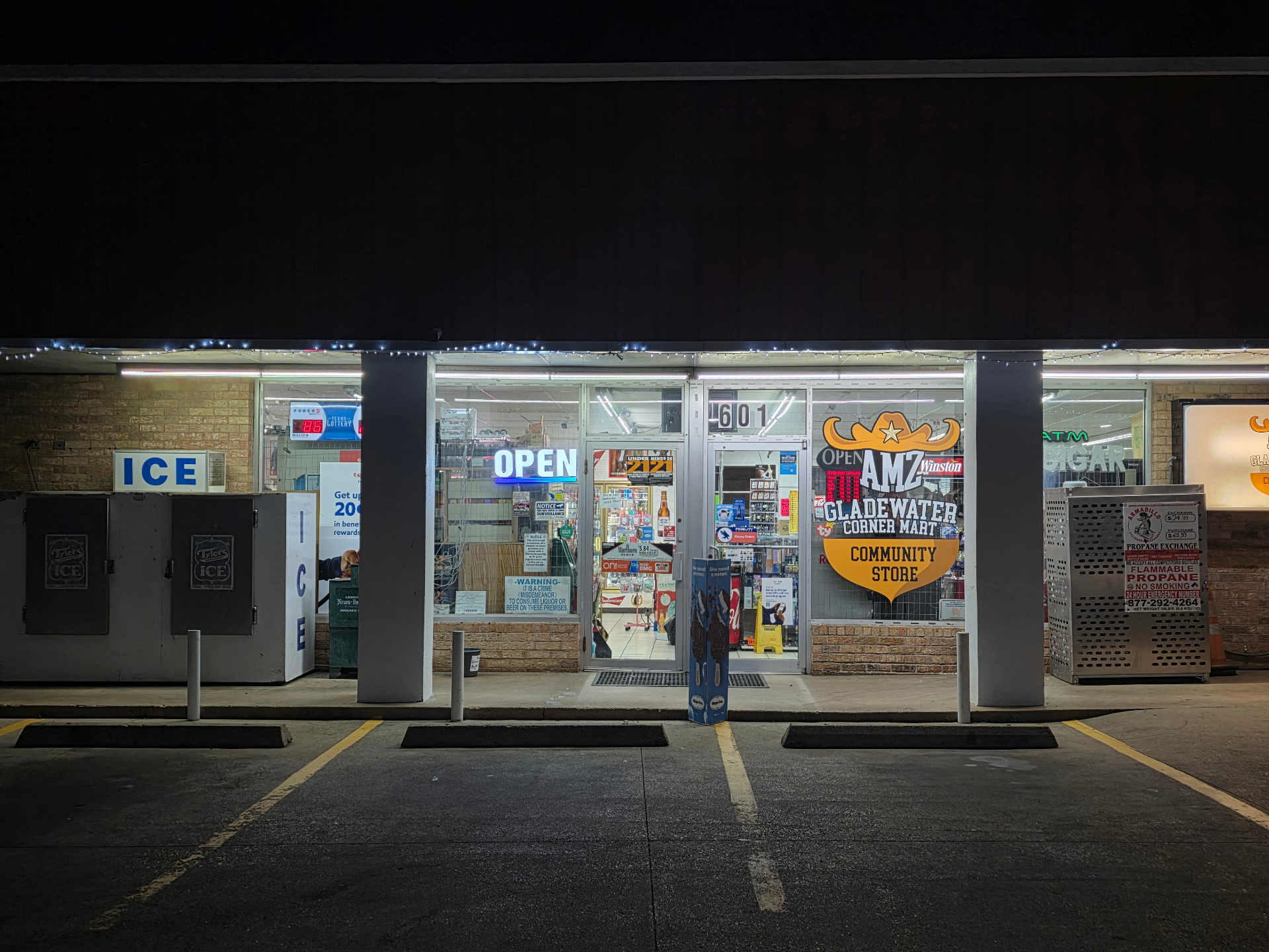 AMZ Gladewater Corner Mart storefront at night